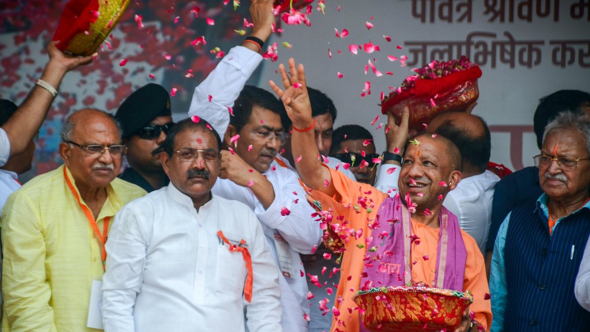 Yogi Adityanath showers flower petals on Kanwariyas in Meerut