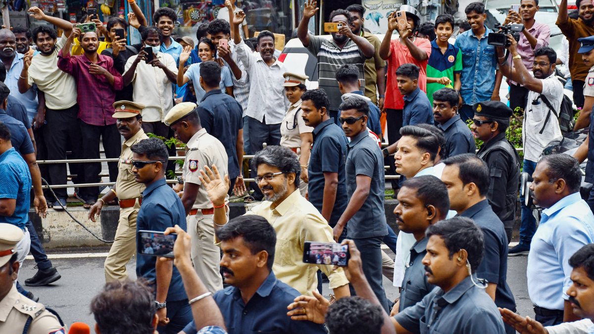 Chennai CM Vijay waves to supporters after MPs meeting