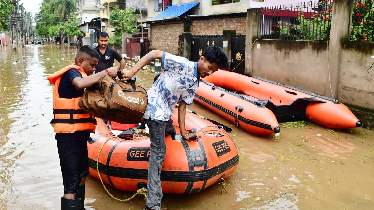 Guwahati residents navigate flooded streets in inflatable boats