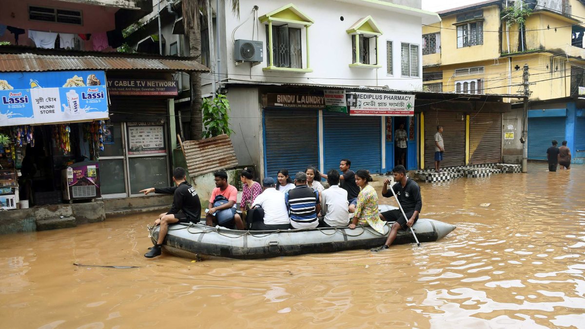 Assam rescue teams evacuate residents from flooded Guwahati locality