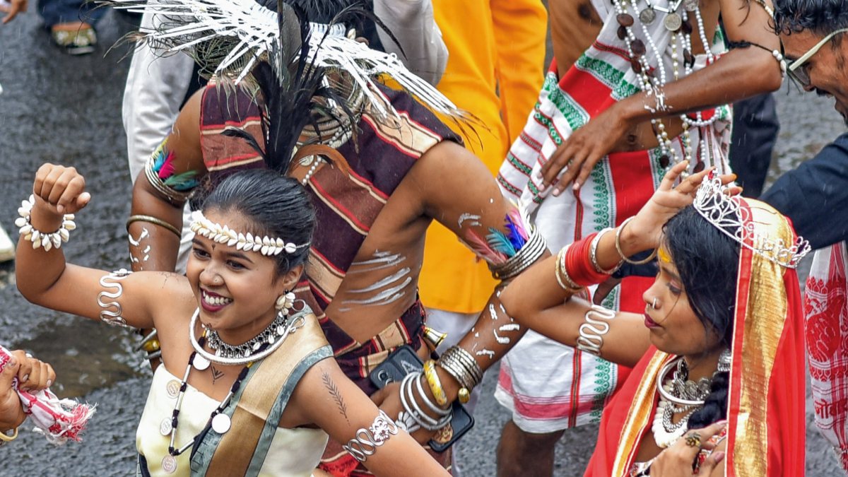 Tribal dancers perform at World Adivasi Day in Nagpur