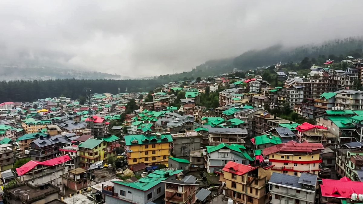 Fog shrouds Manali hills, enhancing scenic beauty