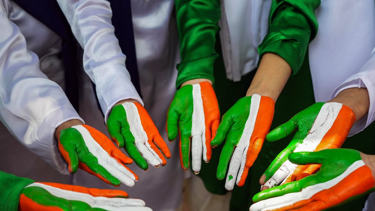 Students paint tricolour hands ahead of Independence Day