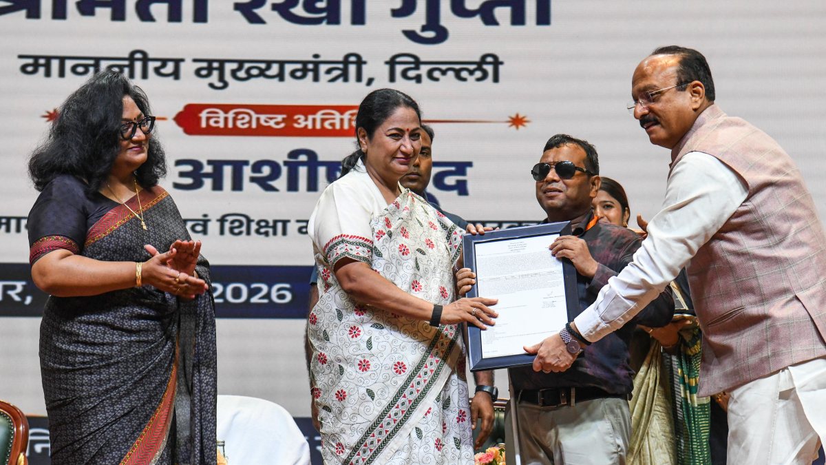 Delhi CM Rekha Gupta hands appointment letter to new teacher at Bharat Mandapam