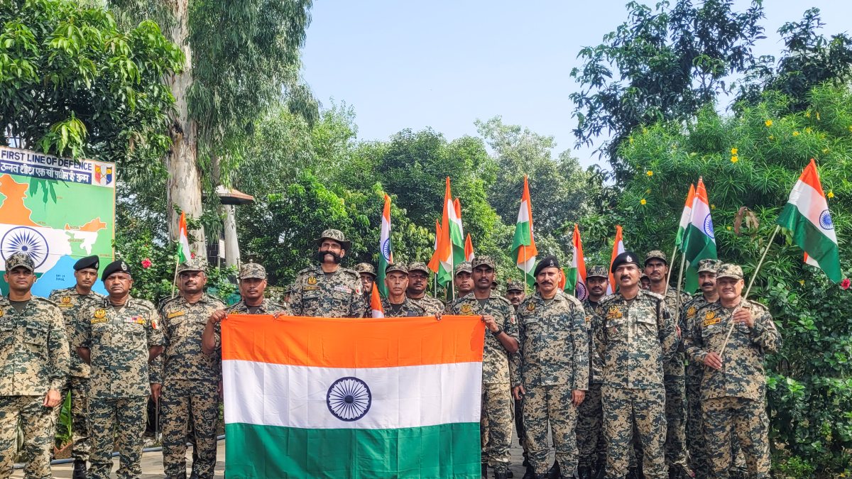BSF personnel hold tricolour during Tiranga Yatra in Samba