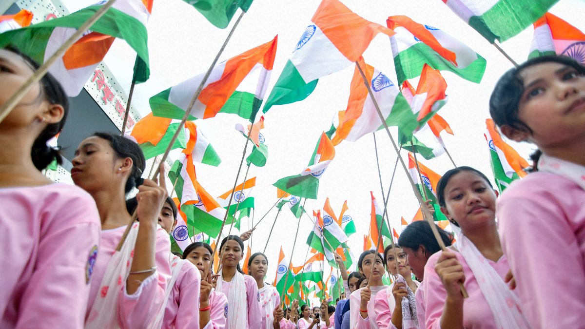Students hold tricolors during Tiranga Yatra in Guwahati