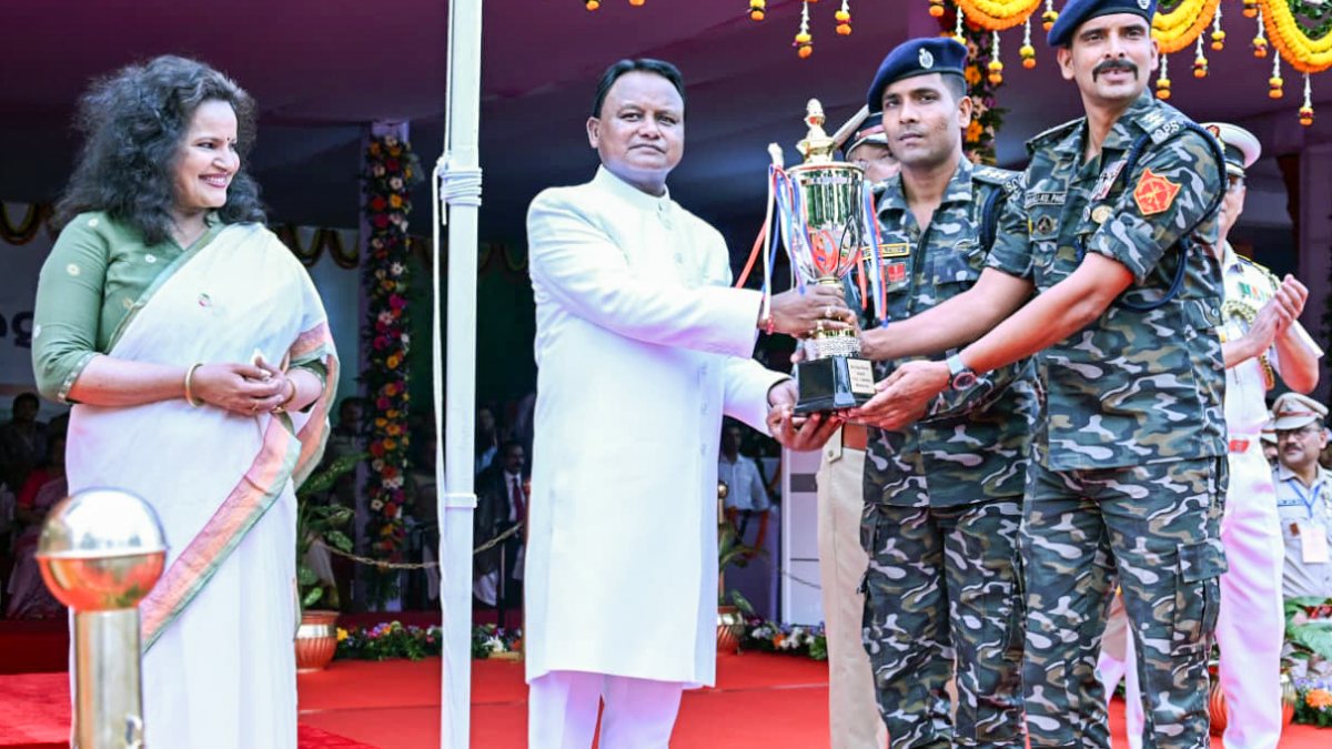 Odisha Chief Minister Mohan Charan Majhi presents a trophy to security…