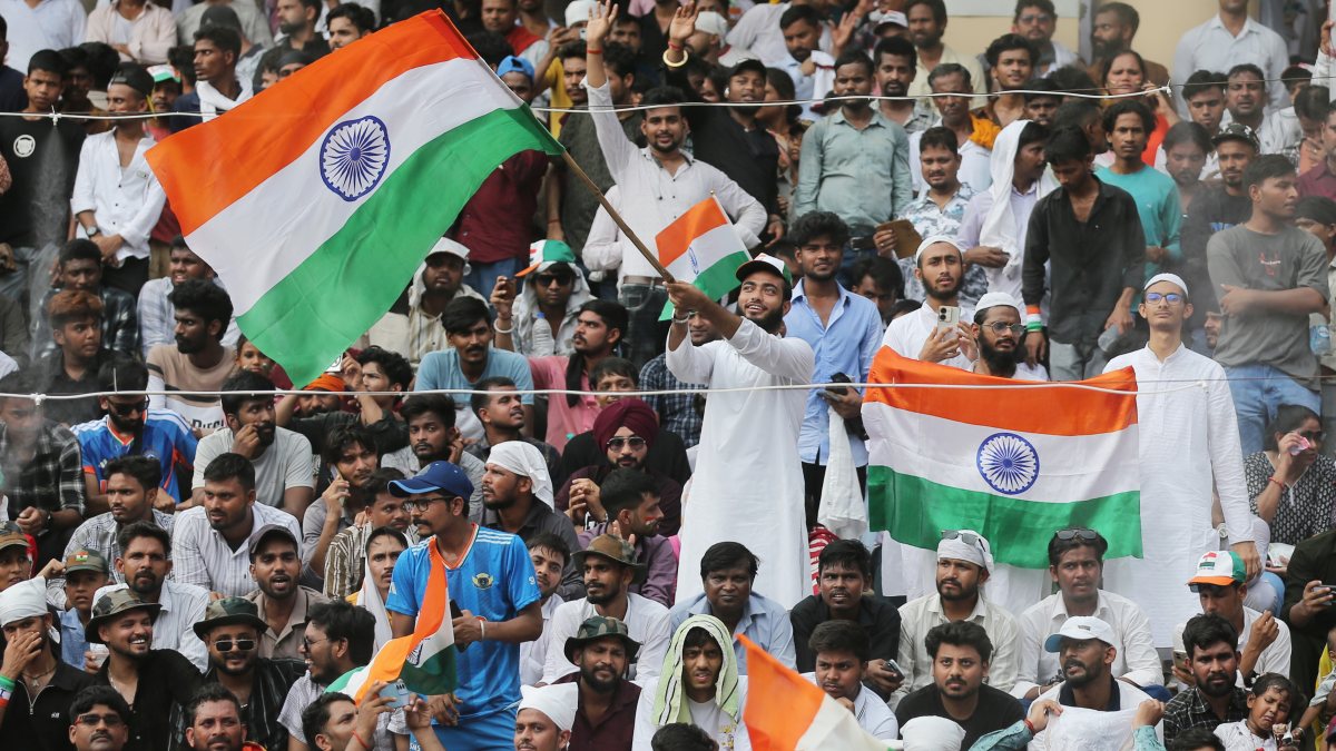 Spectator waves national flag at Attari Wagha on Independence Day