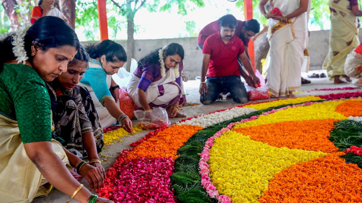 Bhopal Malayali women craft floral pookalam for Onam