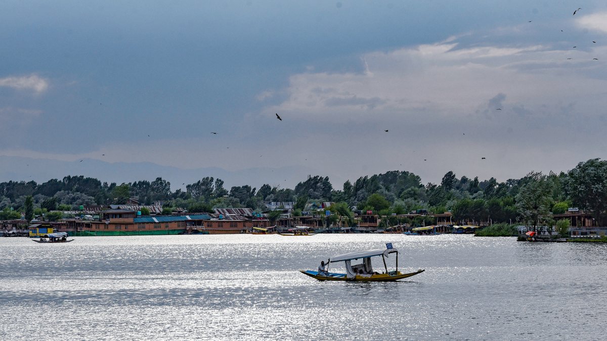 Tourists enjoy Shikara ride on Dal Lake in Srinagar