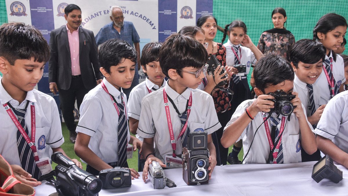 Students explore vintage cameras at World Photography Day in Surat