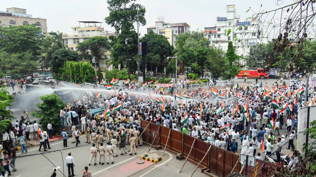 Bihar police water-cannon RJD protesters in Patna