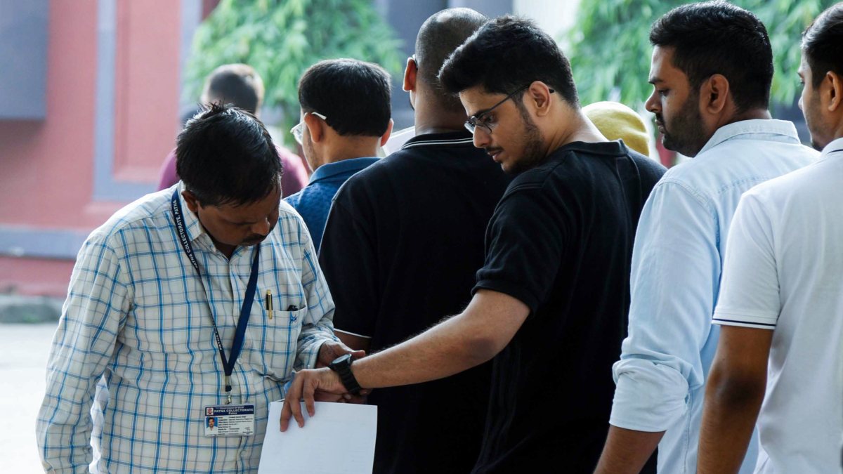 UPSC aspirants queue for security check at Patna exam centre