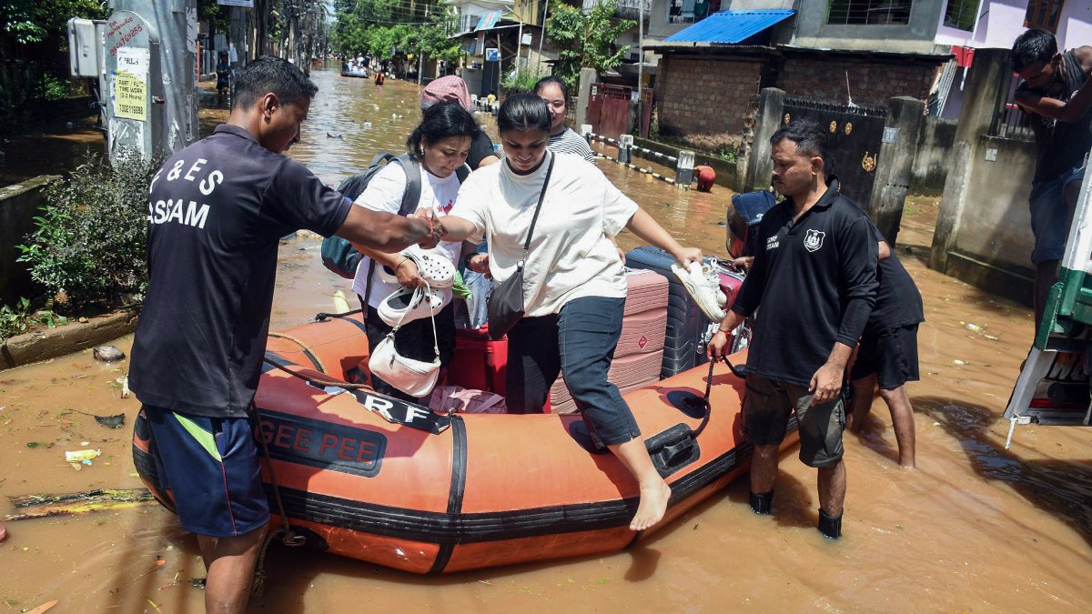 Rescuers evacuate residents from flooded Guwahati locality