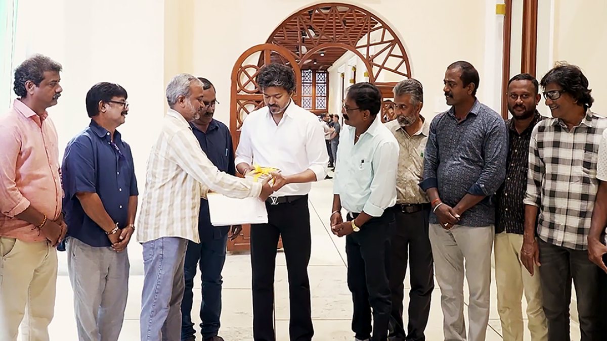 Chennai CM Vijay receives gift on World Photography Day