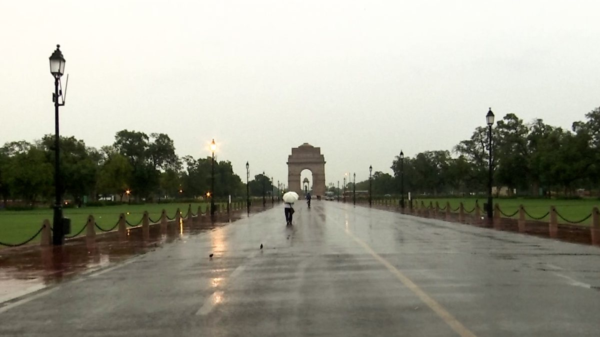 Light rain falls near India Gate on Kartavya Path in Delhi