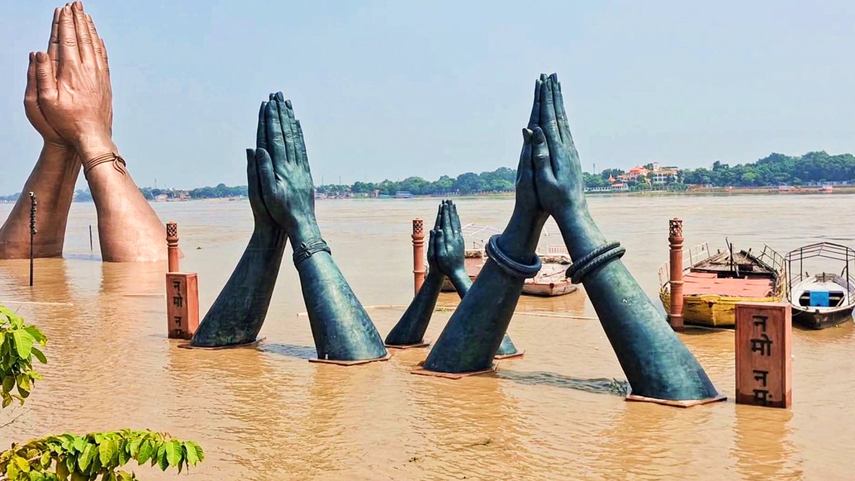 Ganga floodwaters touch Namaste sculpture in Varanasi