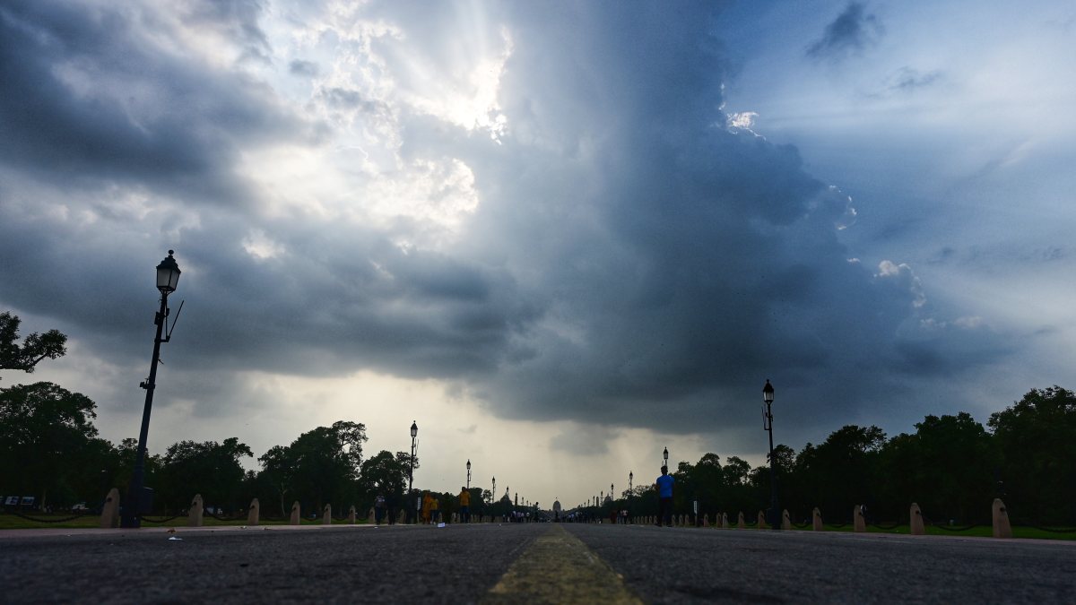 Dark monsoon clouds loom over India Gate in New Delhi