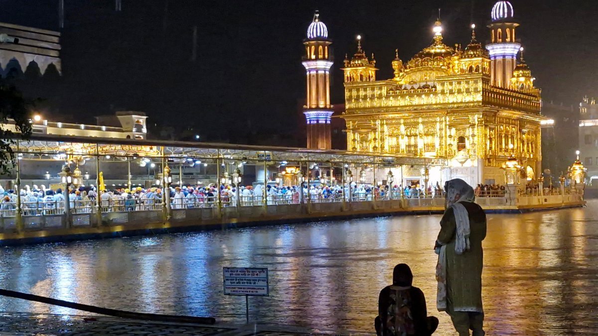 Monsoon rain bathes illuminated Golden Temple in Amritsar