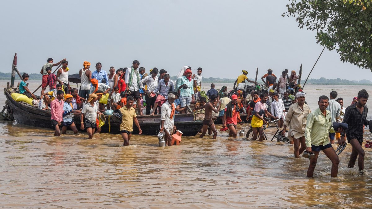 Bihar floods: Residents navigate Ganga waters by boat in Patna
