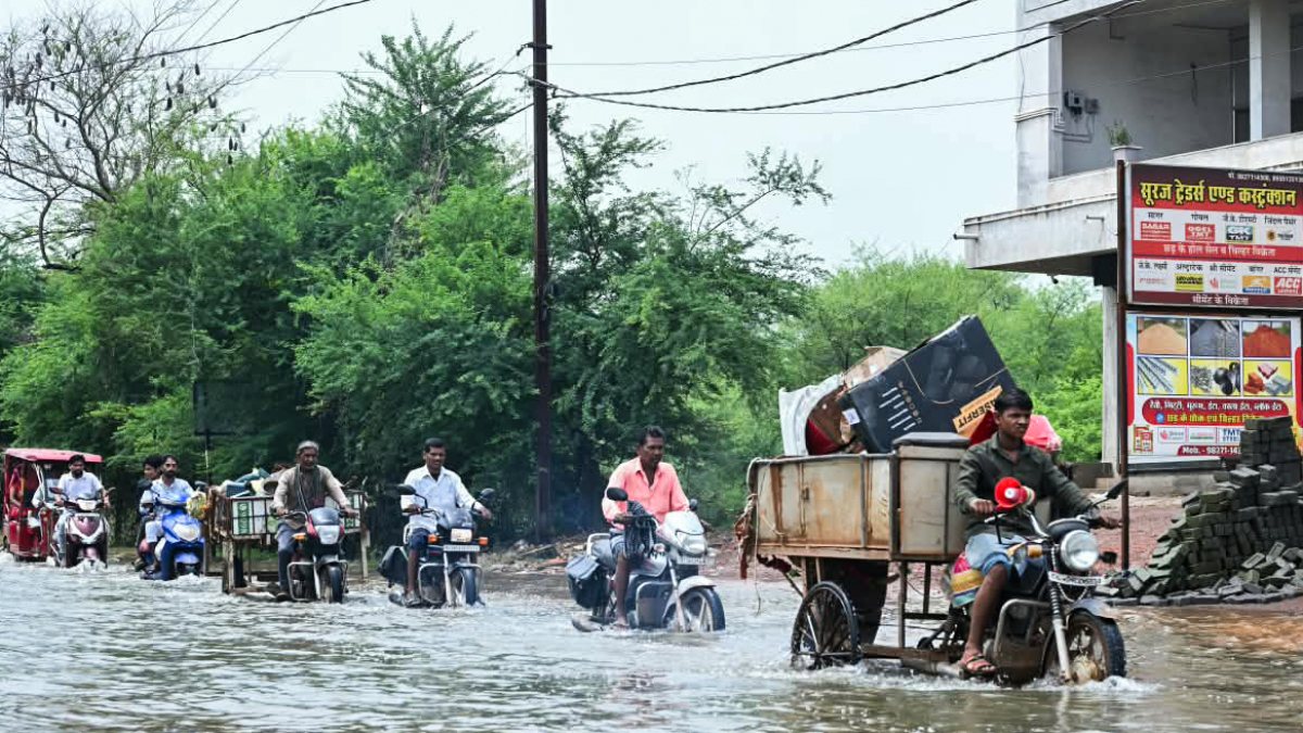 Raipur commuters wade through waterlogged streets after rainfall
