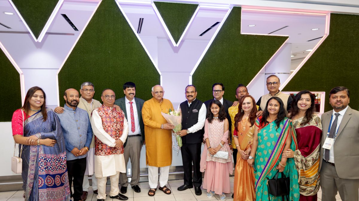 Gujarat CM Bhupendra Patel poses with group at Toronto airport