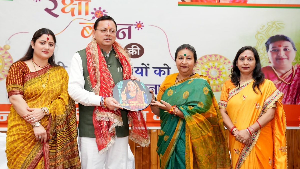 Uttarakhand CM Dhami felicitated with wife at Raksha Bandhan event