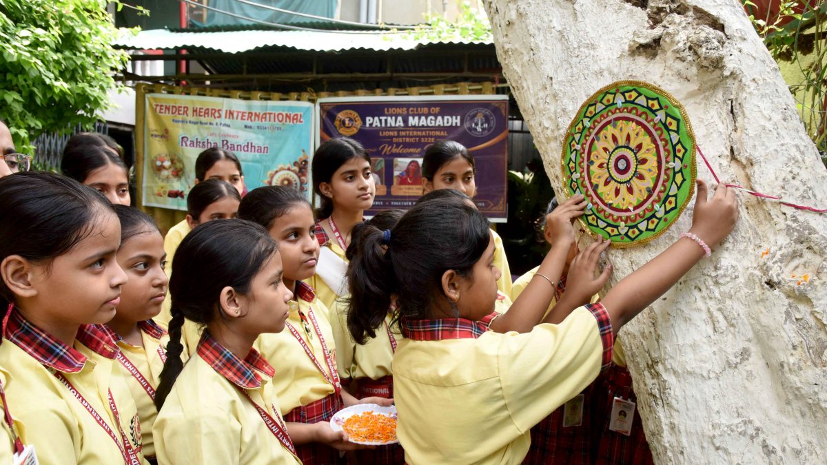 Students tie Rakhi on tree trunks ahead of festival in Patna