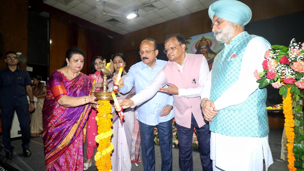 Delhi CM lights lamp at women's university induction programme
