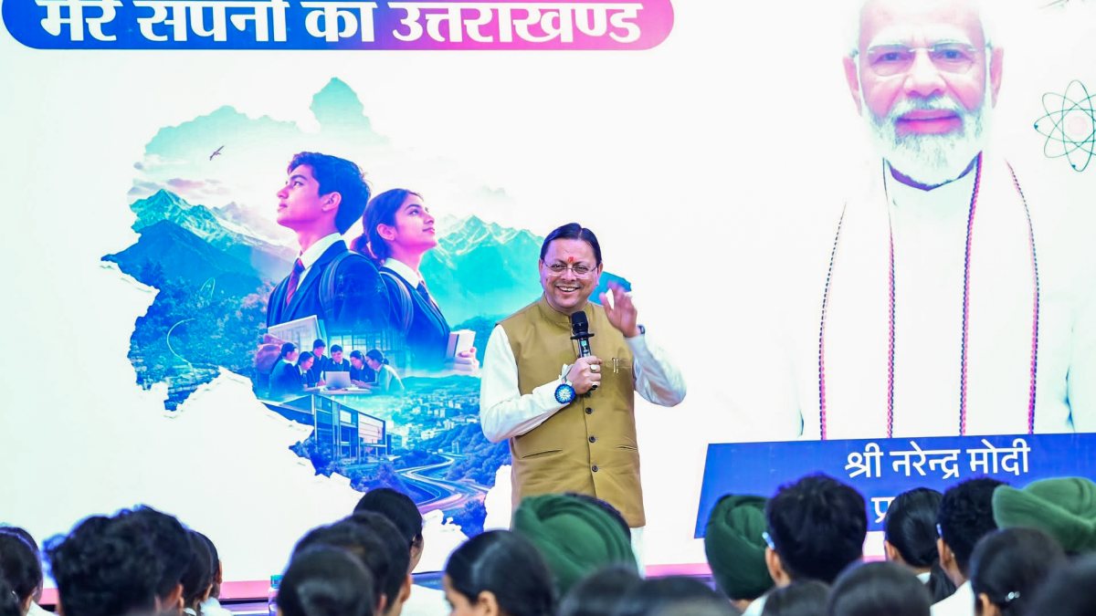 Dhami interacts with students at Yuva Vidyarthi Manthan in Rudrapur