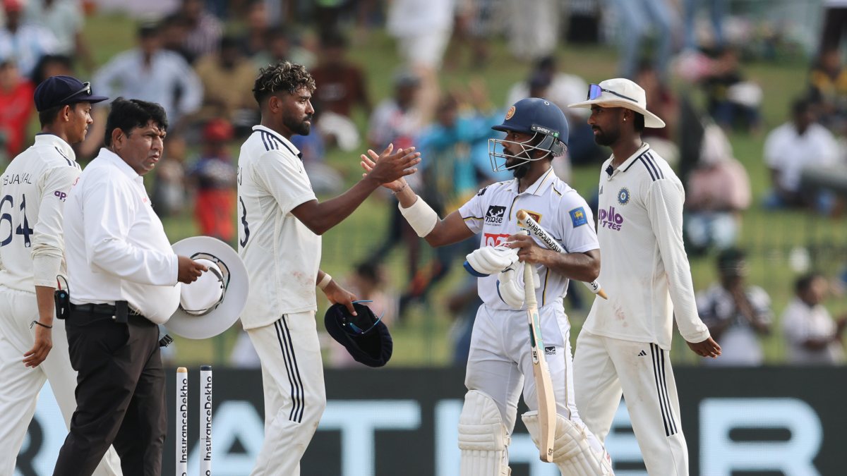 India's Siraj greets Sri Lanka's Dinusha after 2nd Test