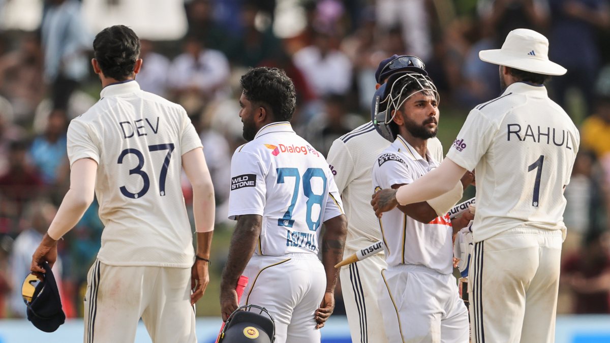 India's KL Rahul greets Sri Lanka's Sonal Dinusha after 2nd Test