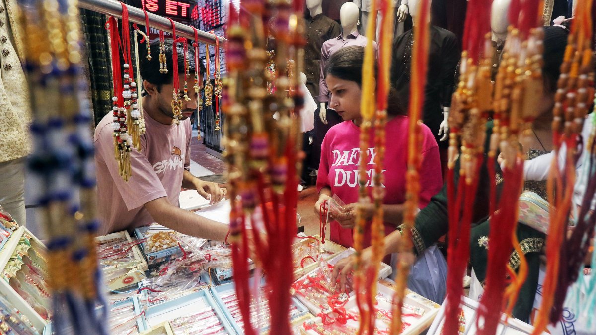 Women shop for Rakhis on eve of Raksha Bandhan in Delhi