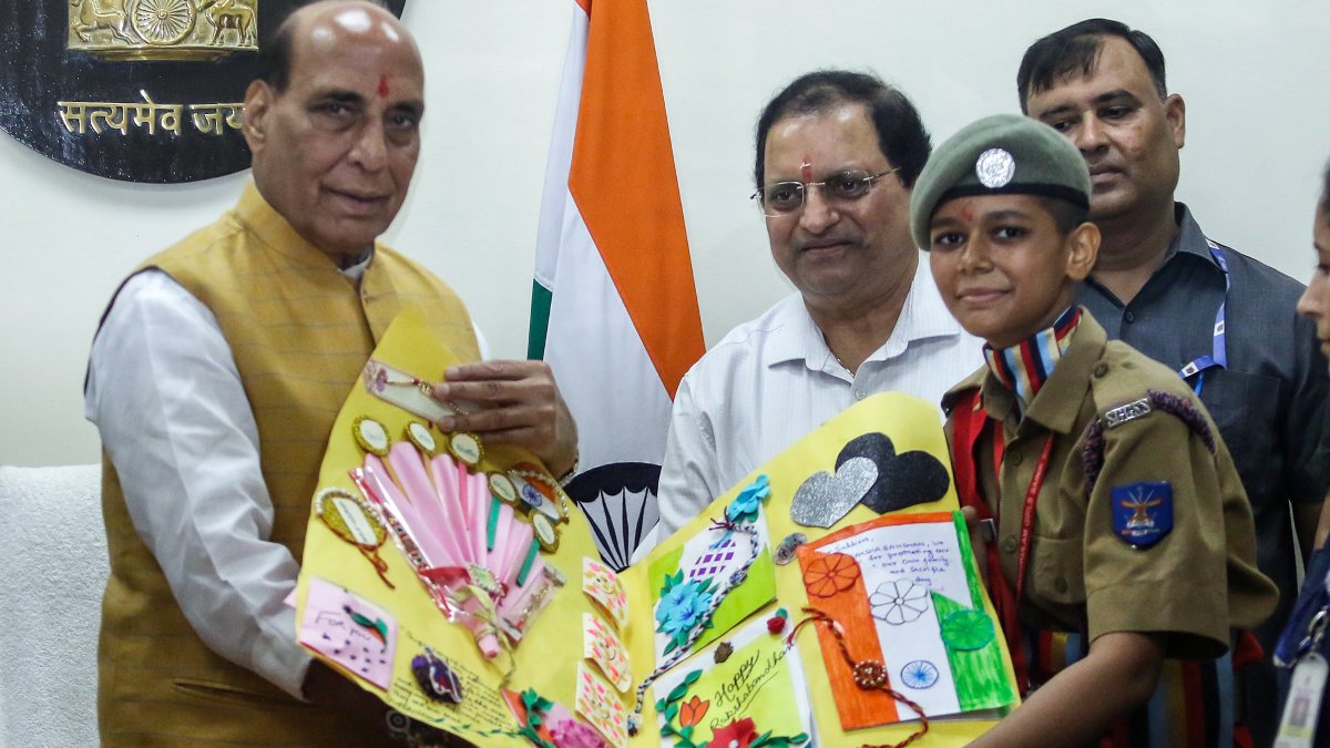 NCC cadet ties rakhi on Rajnath Singh in New Delhi