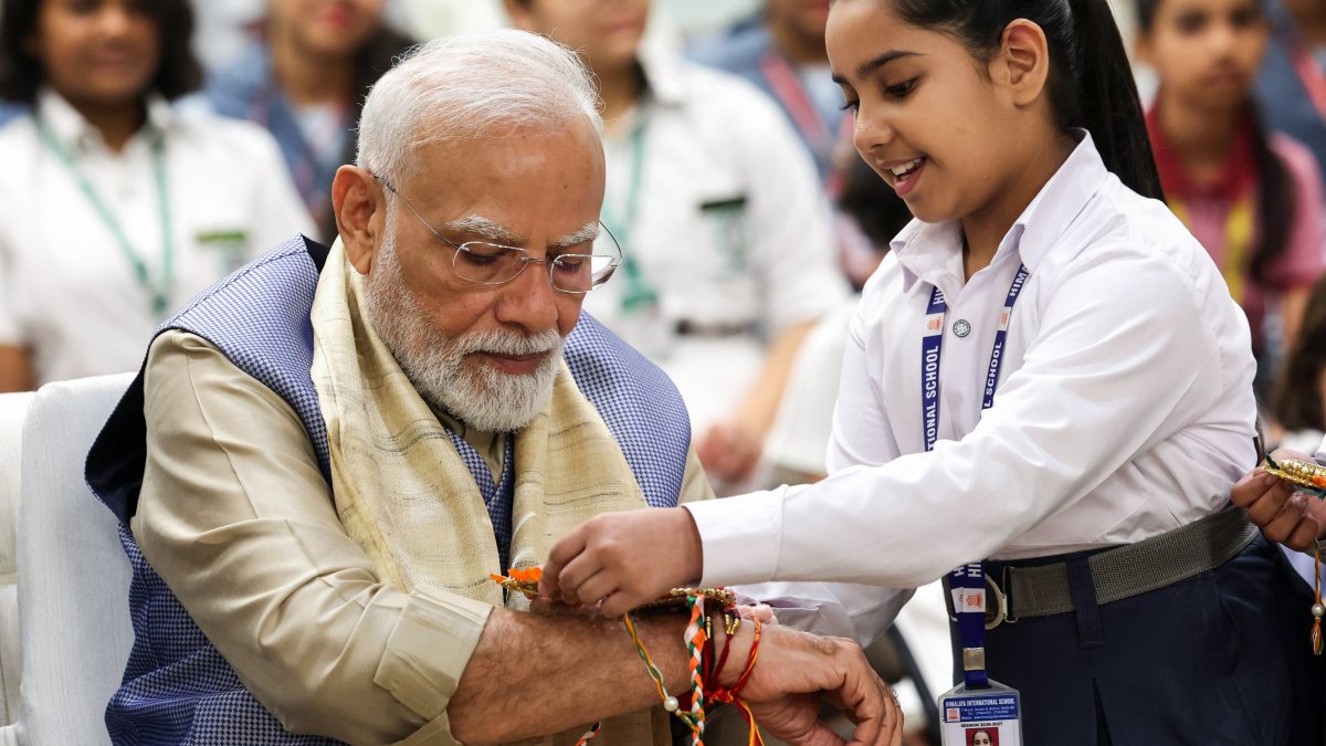 PM Modi receives Rakhi from student at Delhi event