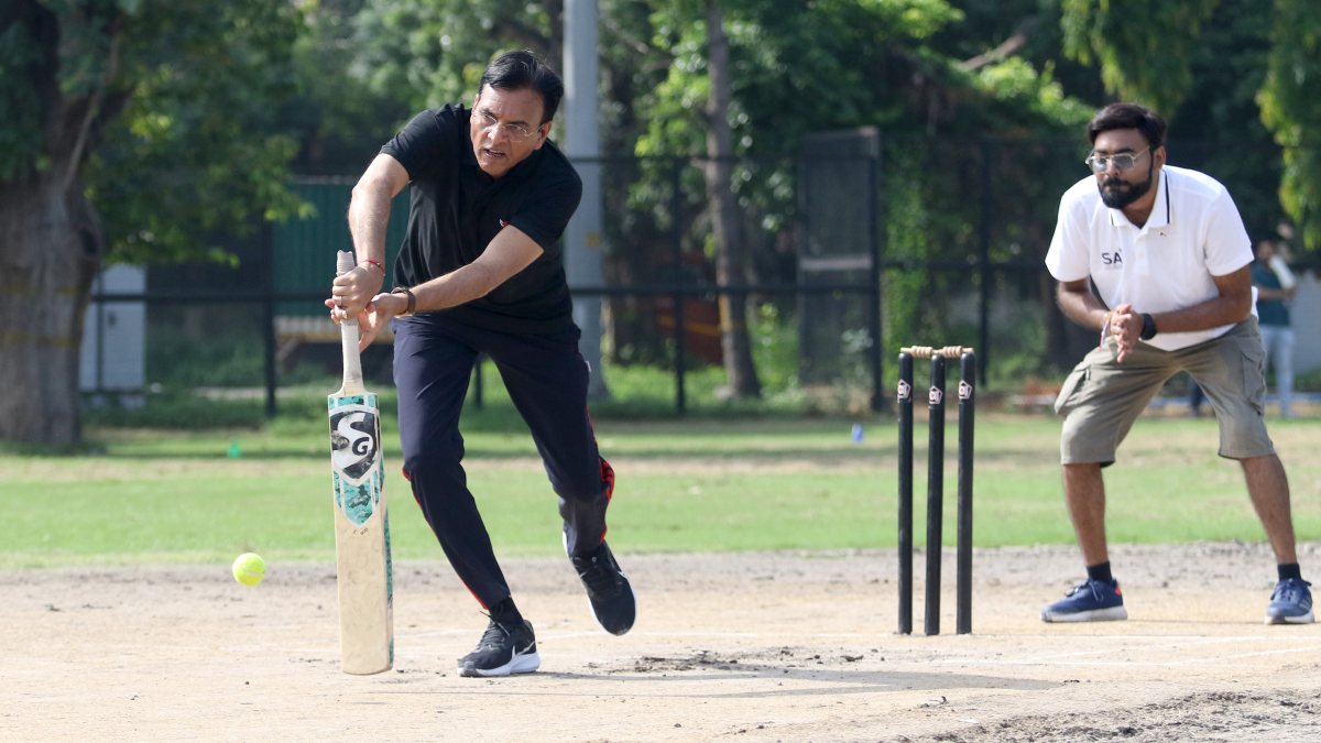 Minister Mandaviya plays cricket on National Sports Day in Delhi