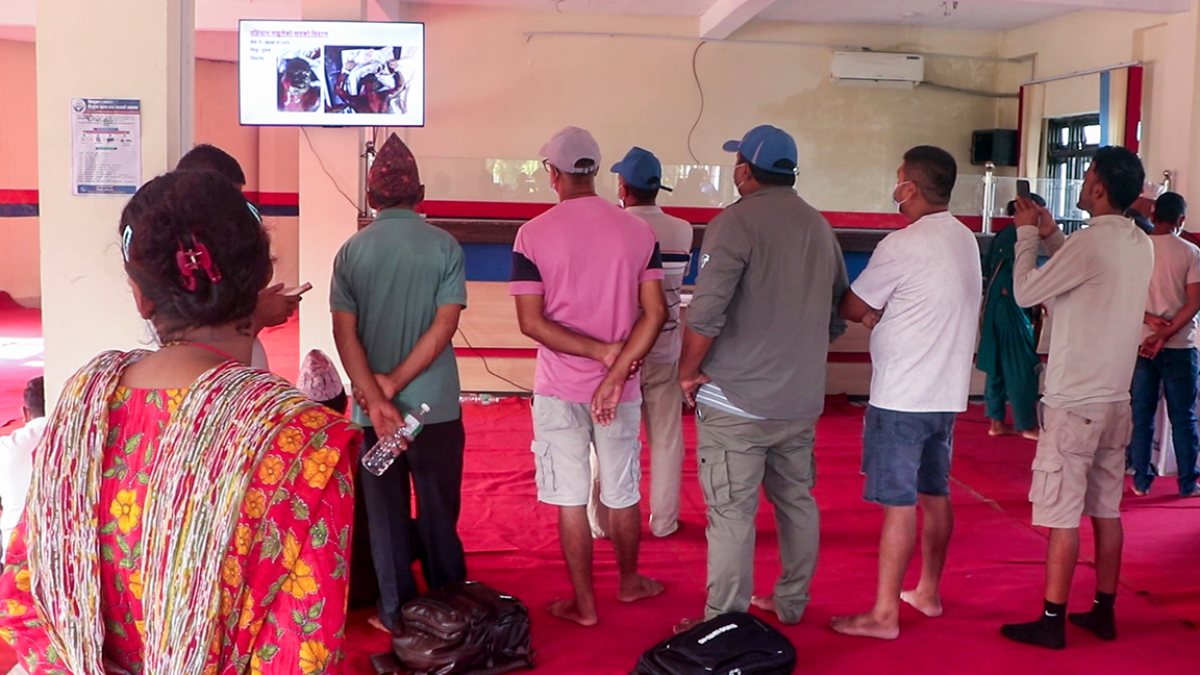 Flood survivors search photos for missing kin in Chitwan