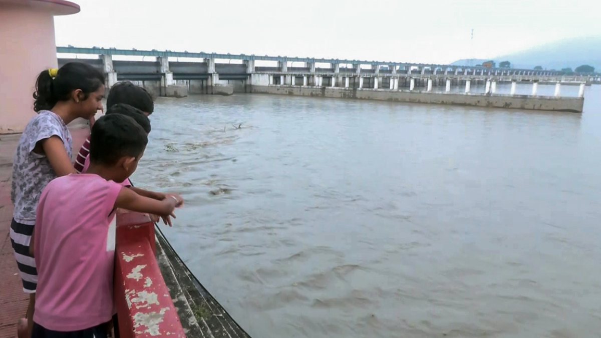Children watch Gandak River water levels amid Nepal flood