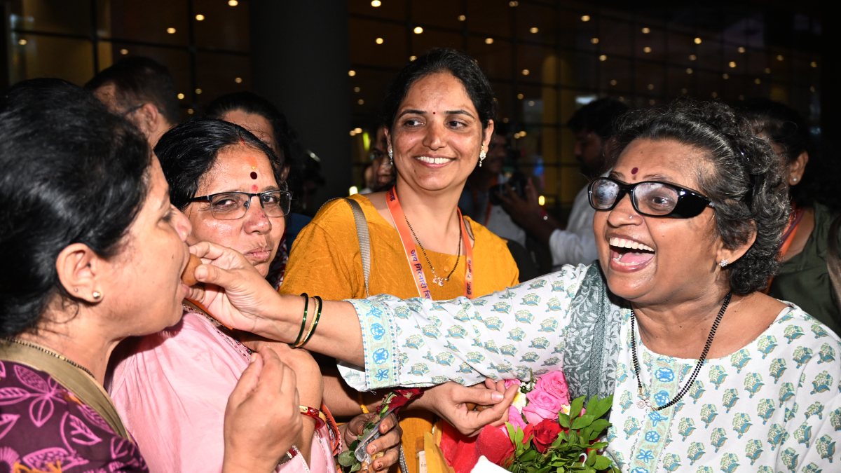 Passengers reunite with families at Mumbai airport after Nepal floods