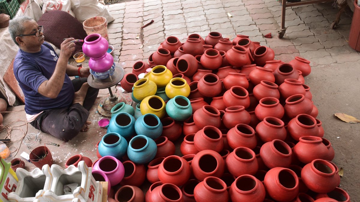 Potters put final touches on Dahi Handi matkis ahead of Janmashtami