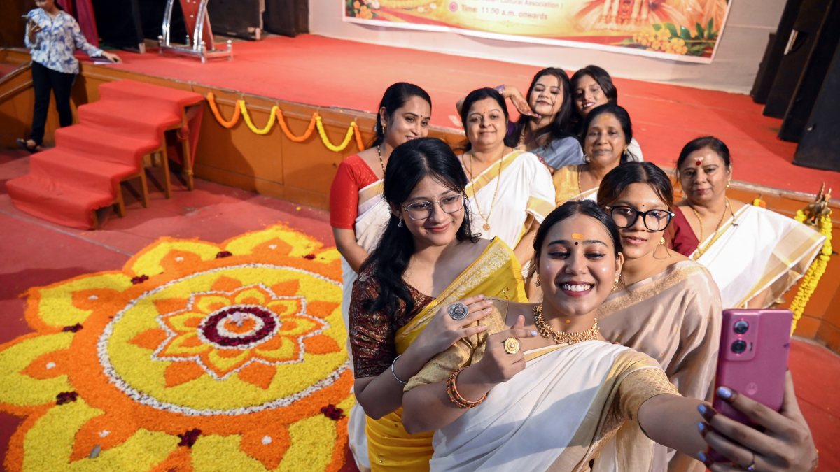 Women click selfie with floral rangoli at Onam fest in Patna