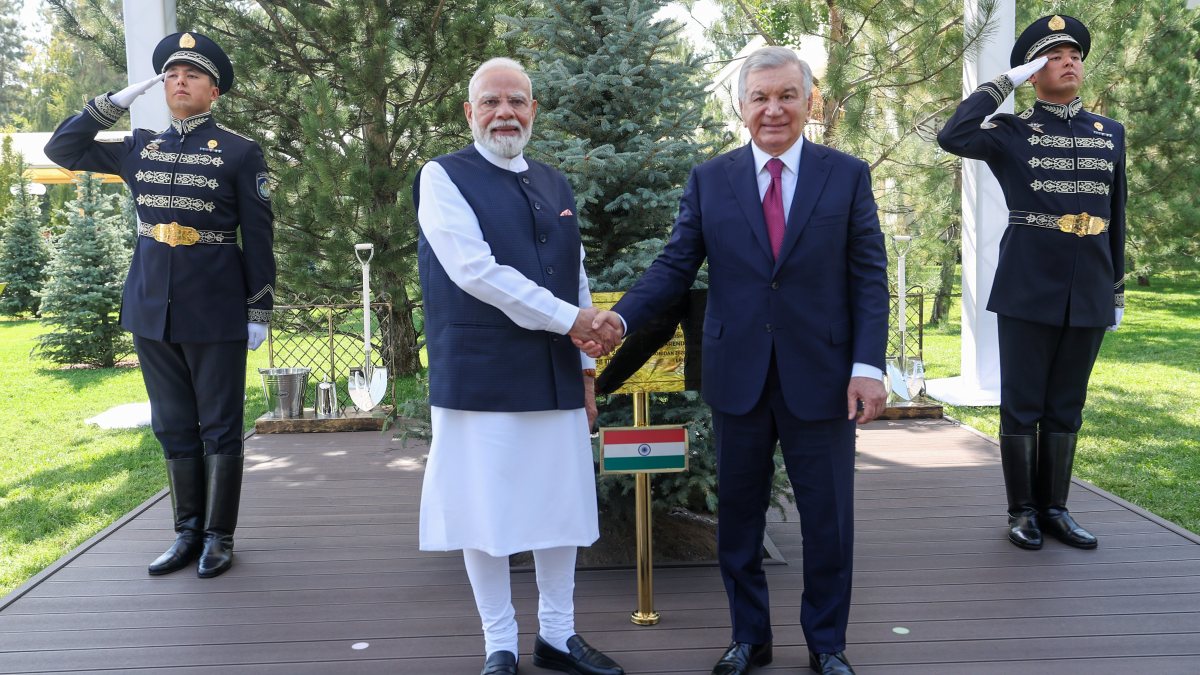 Prime Minister Narendra Modi and Uzbekistan President Shavkat Mirziyoyev shake…