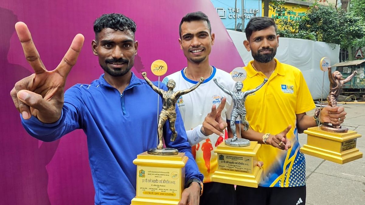 Marathon winners pose with trophies after Thane Varsha Marathon