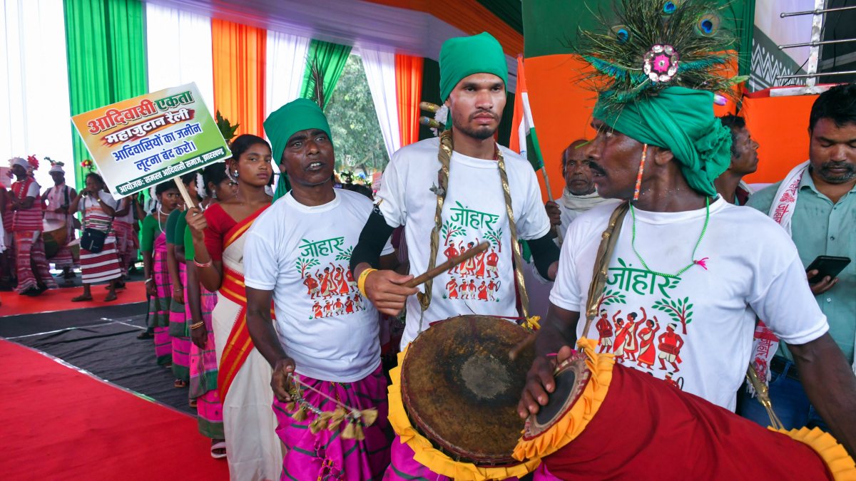 Tribal men play traditional drums at Adivasi gathering in Ranchi