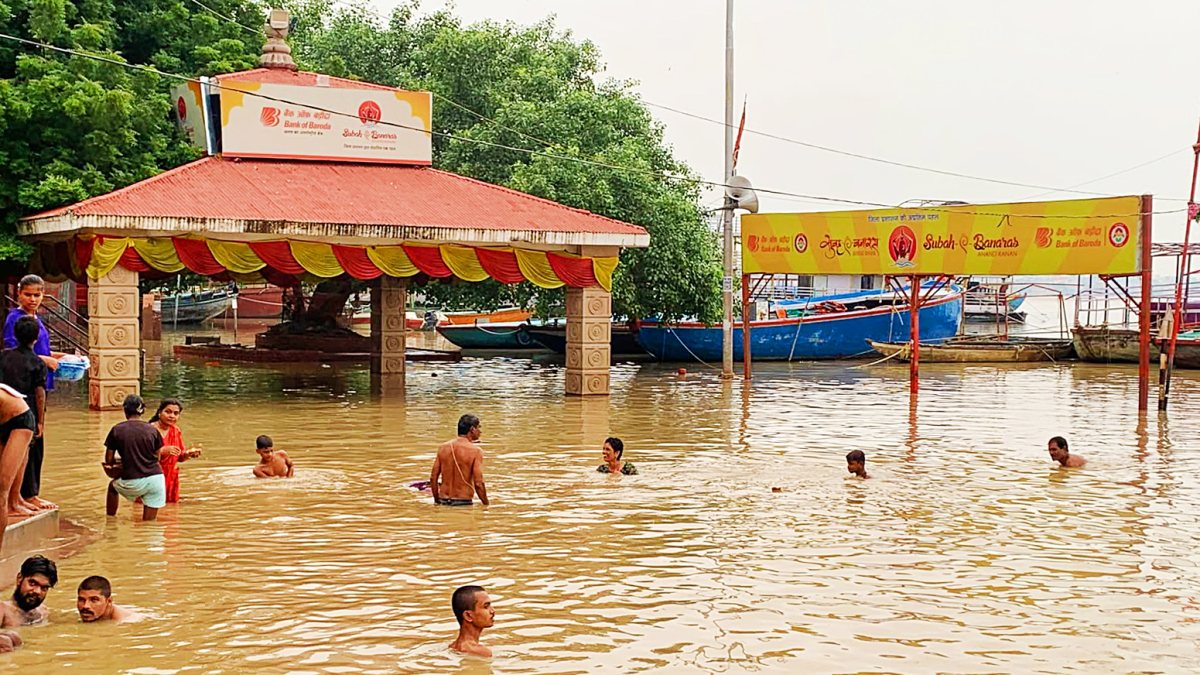 Varanasi residents take holy dip as Ganga swells at Assi Ghat
