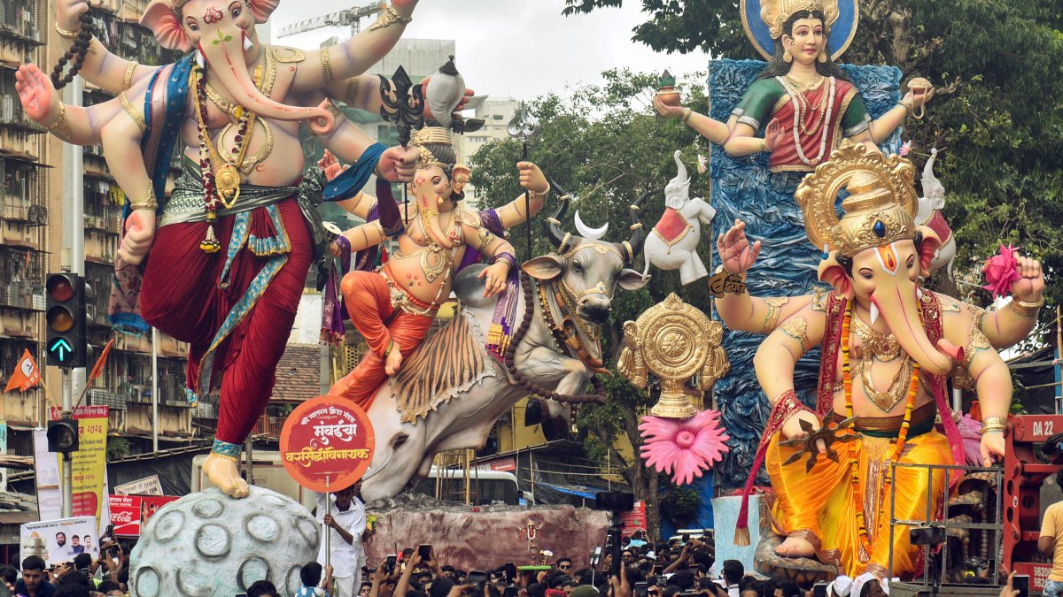 Mumbai devotees carry Ganesh idols in Agman procession