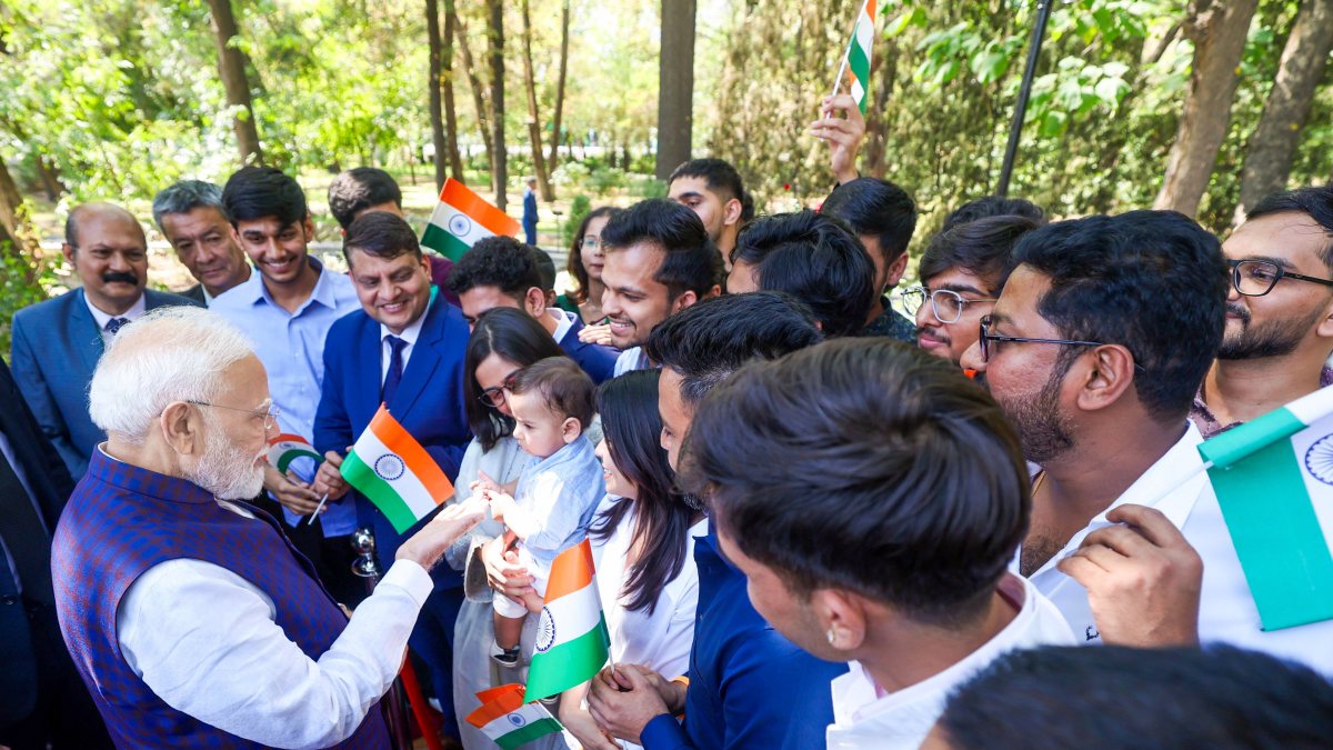 PM Modi meets Indian diaspora in Bishkek, interacts with child
