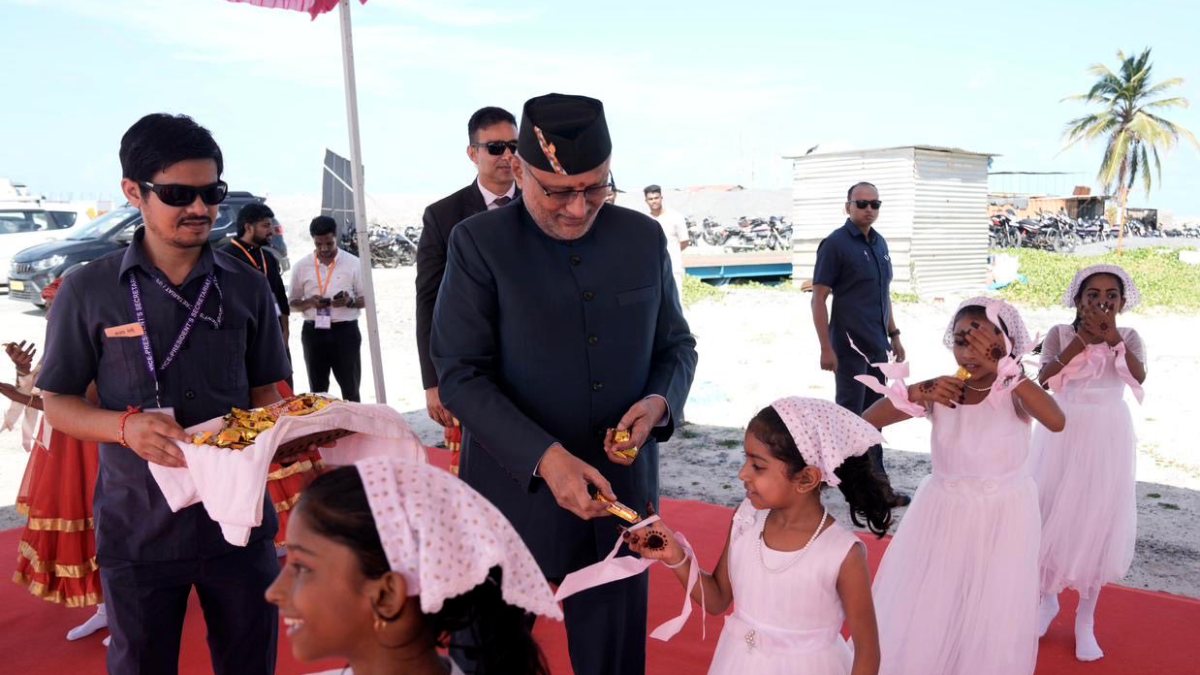 VP offers chocolates to child at Lakshadweep cultural event