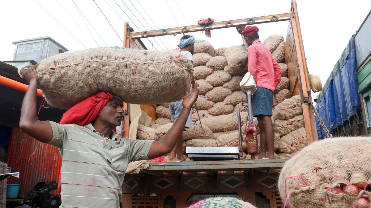 Onion sacks unloaded at Agartala wholesale market