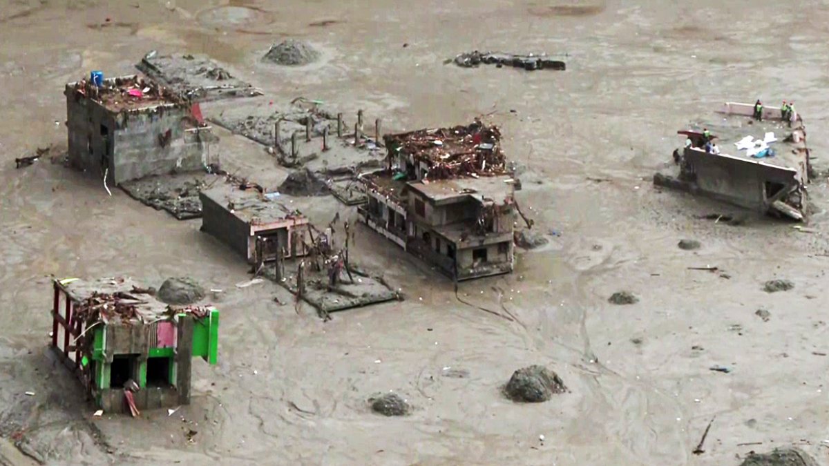 Aerial view shows houses submerged in mud during Nepal Army rescue